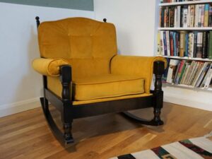 Buttoned rocking armchair